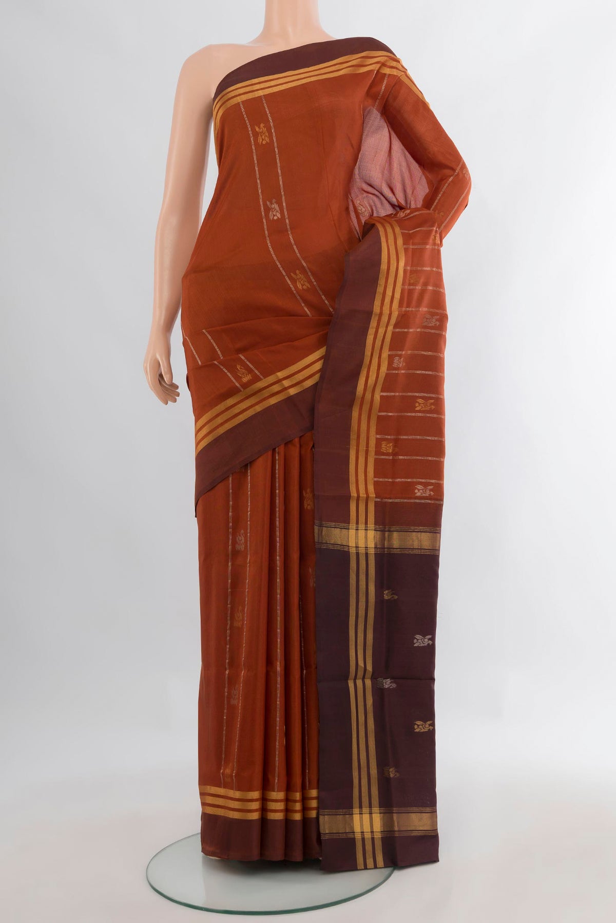 Pure Silk Rust Uppada Saree with Zari Butta on the body and Zari Border.  displayed on a mannequin