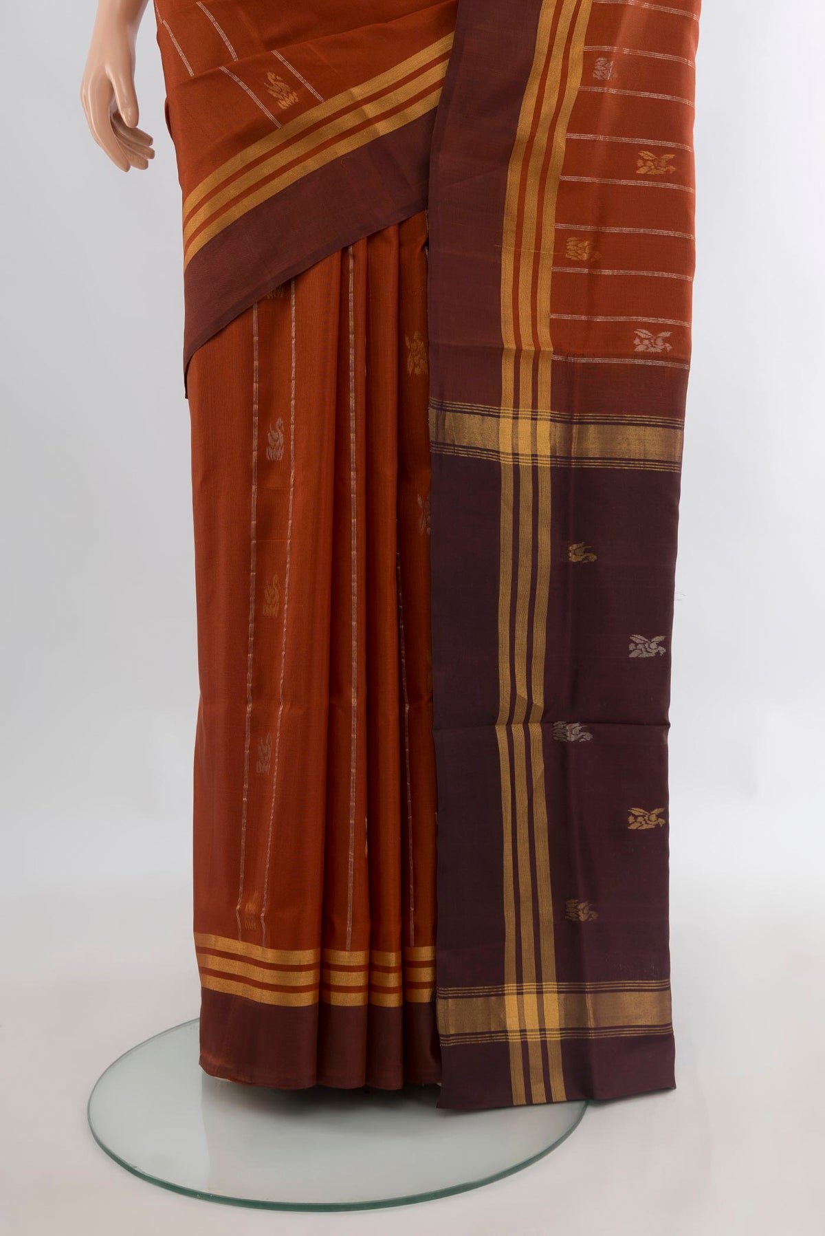 Pleats and pallu of Pure Silk Rust Uppada Saree with Zari Butta on the body and Zari Border. 