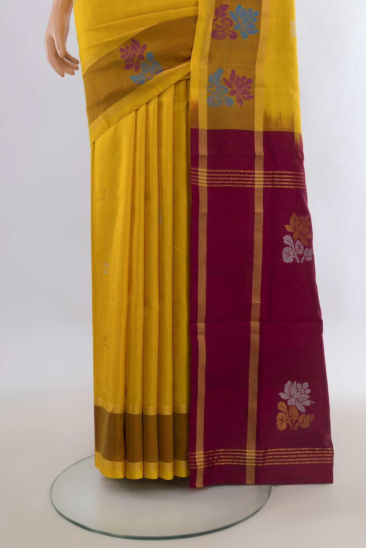 Pleats and pallu of Pure Silk Yellow Uppada Saree with Plain Body and Zari Border. 