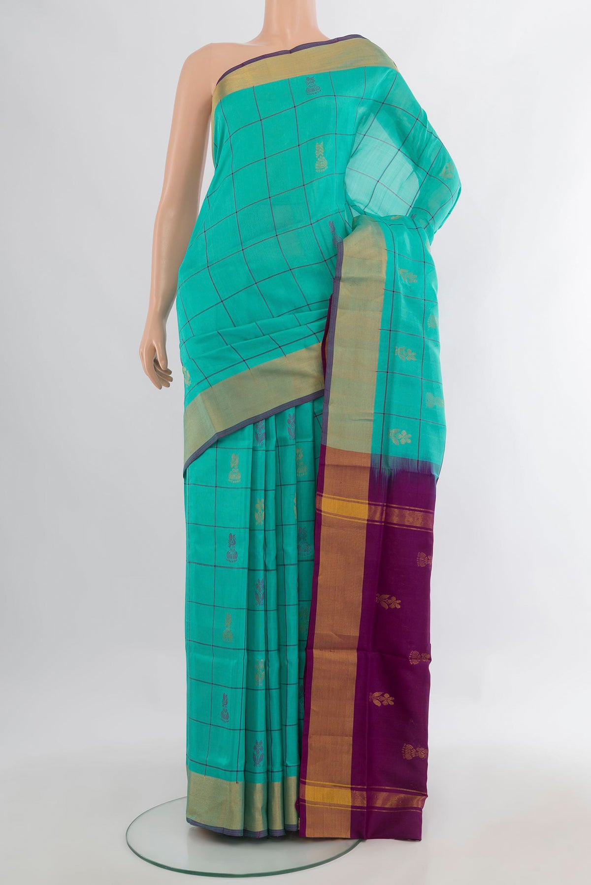 Pure Silk Sea Green Uppada Saree with Zari Butta on the body and Zari Border.  displayed on a mannequin