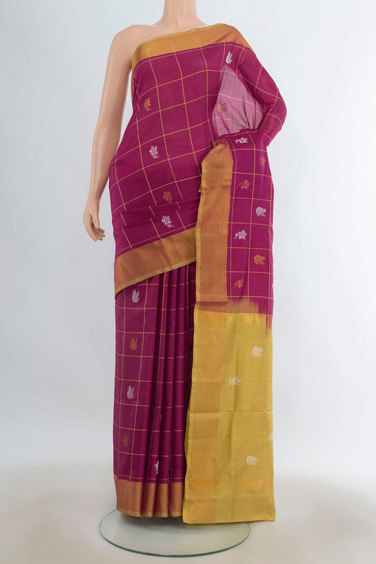 Pure Silk Magenta Uppada Saree with Checked design on the body and Zari Border.  displayed on a mannequin