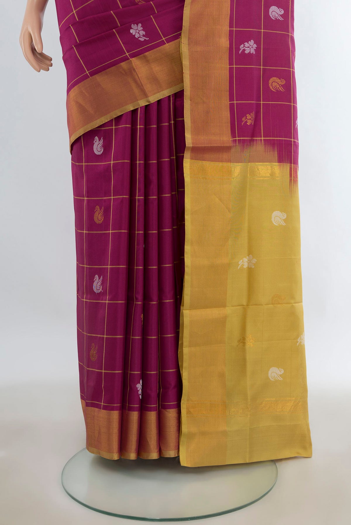 Pleats and pallu of Pure Silk Magenta Uppada Saree with Checked design on the body and Zari Border. 