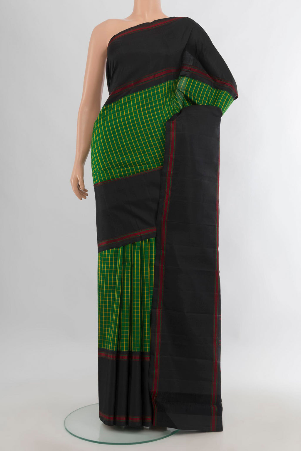 Pure Silk Green Kanjivaram Saree with Checked design on the body and Plain Border.  displayed on a mannequin