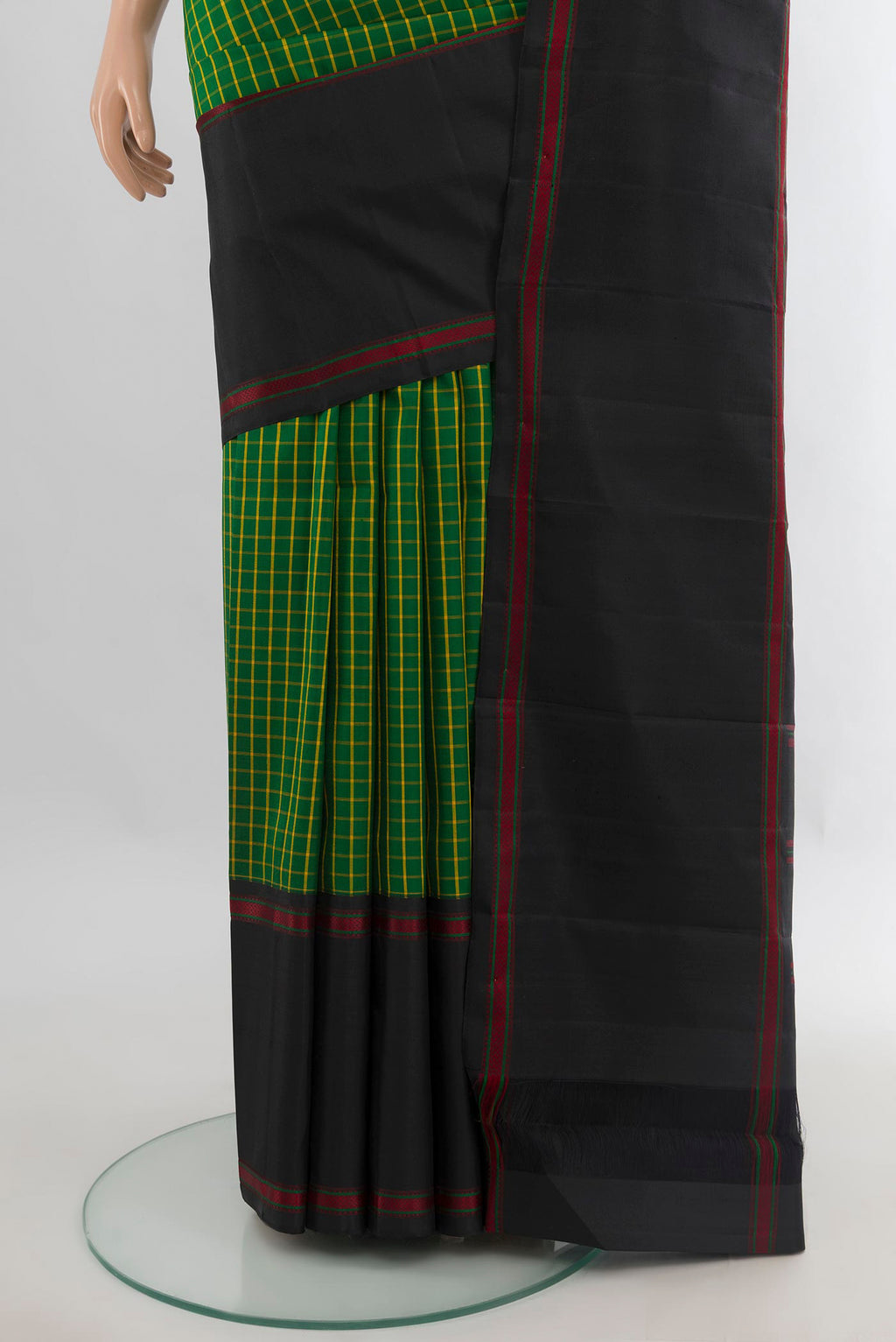 Pleats and pallu of Pure Silk Green Kanjivaram Saree with Checked design on the body and Plain Border. 