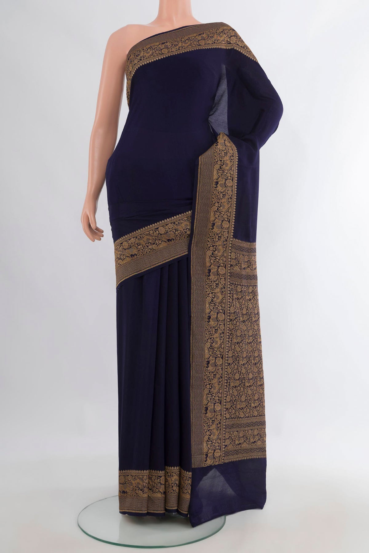 Navy Blue Banarasi Georgette Saree with Plain Body and Zari Border.  displayed on a mannequin