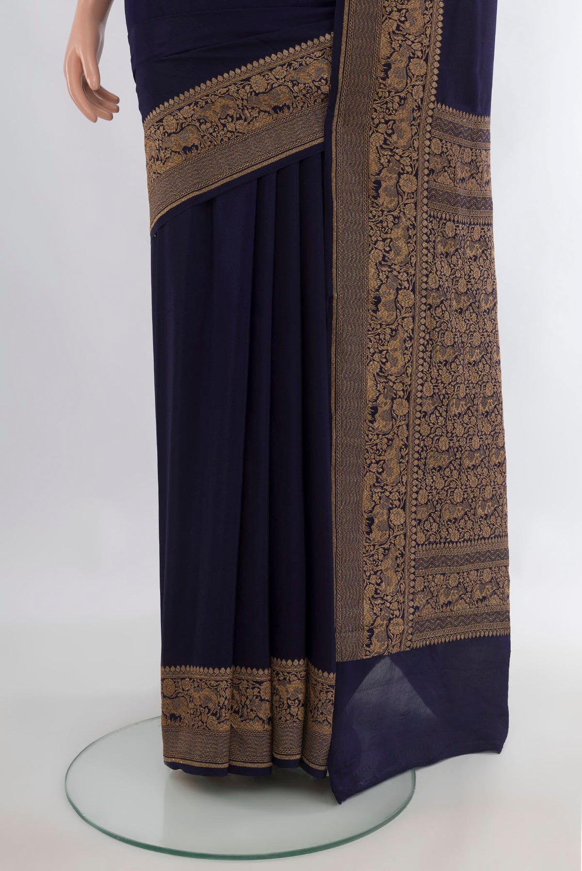 Pleats and pallu of Navy Blue Banarasi Georgette Saree with Plain Body and Zari Border. 