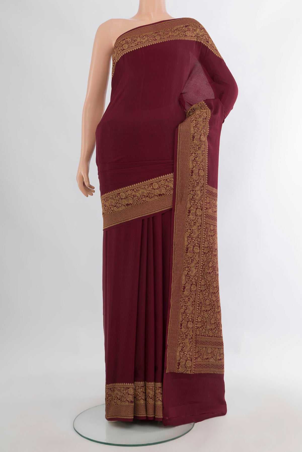 Maroon Banarasi Georgette Saree with Plain Body and Zari Border.  displayed on a mannequin