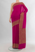 Magenta Banarasi Georgette Saree with Plain Body and Zari Border.  displayed on a mannequin