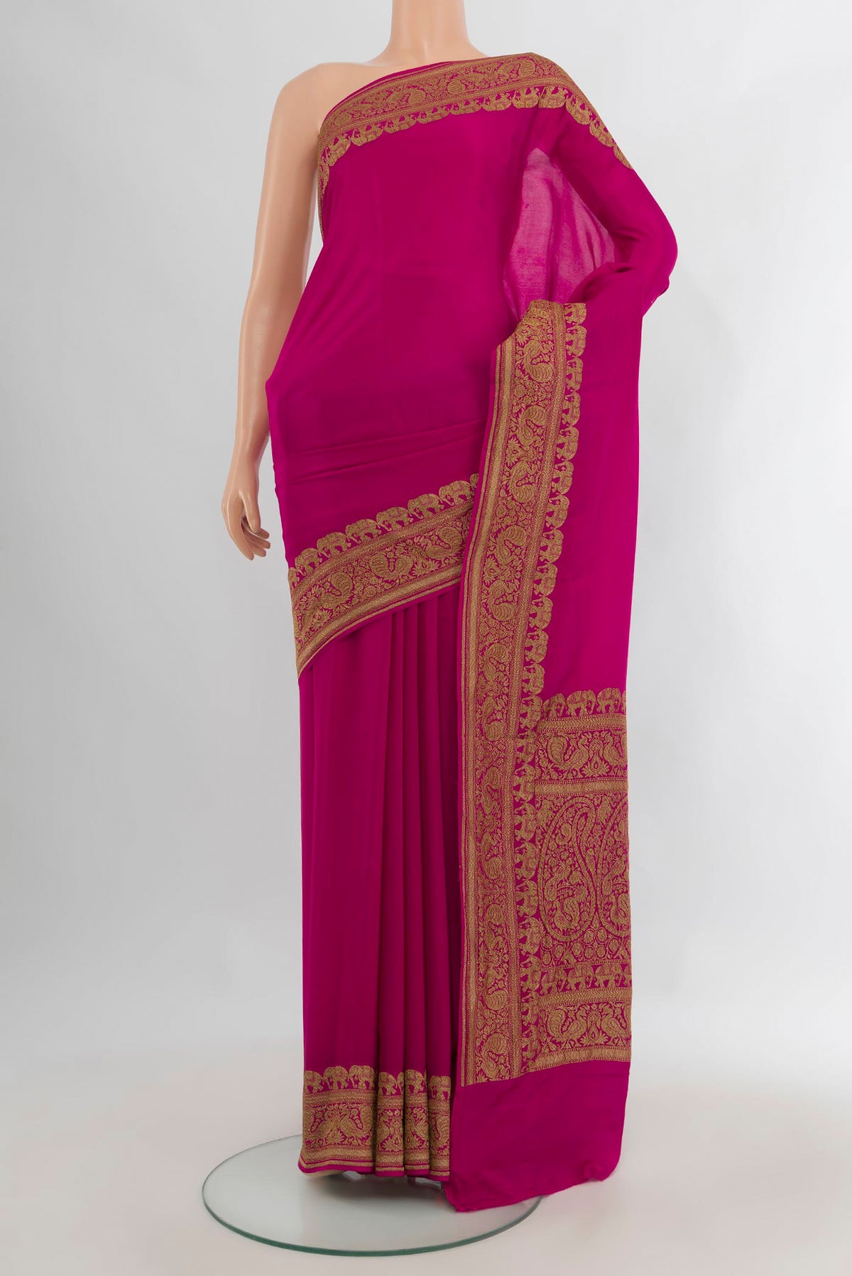 Magenta Banarasi Georgette Saree with Plain Body and Zari Border.  displayed on a mannequin