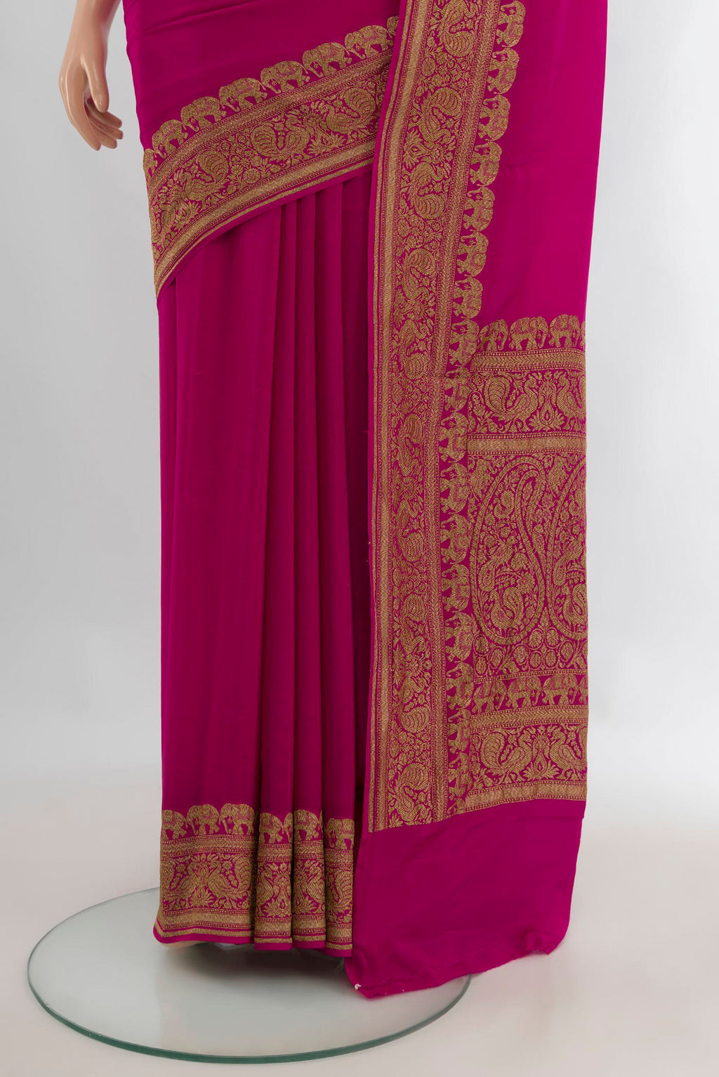 Pleats and pallu of Magenta Banarasi Georgette Saree with Plain Body and Zari Border. 