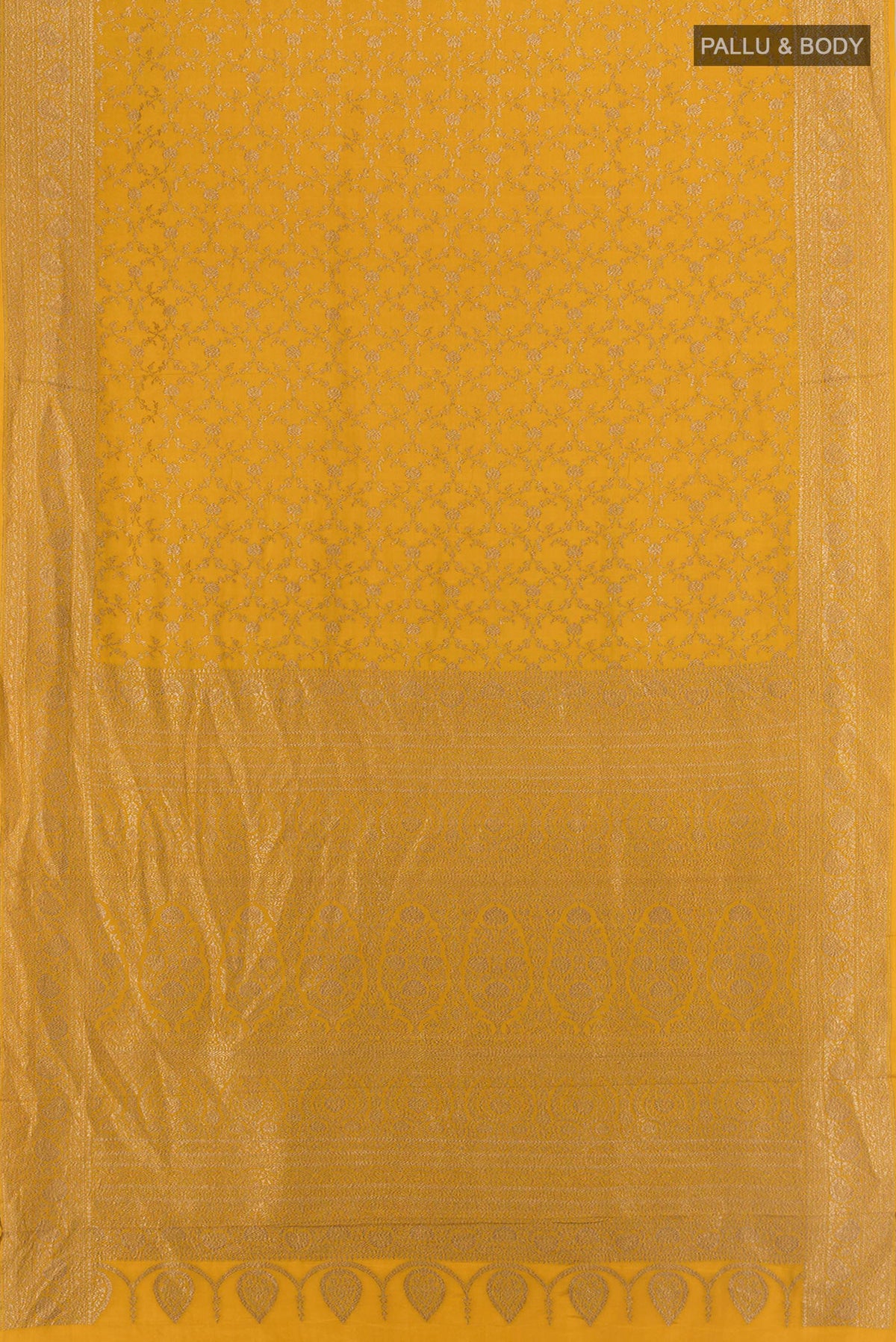 Flat view of Mustard Banarasi Georgette Saree with Zari Brocade on the body and Zari Border. 