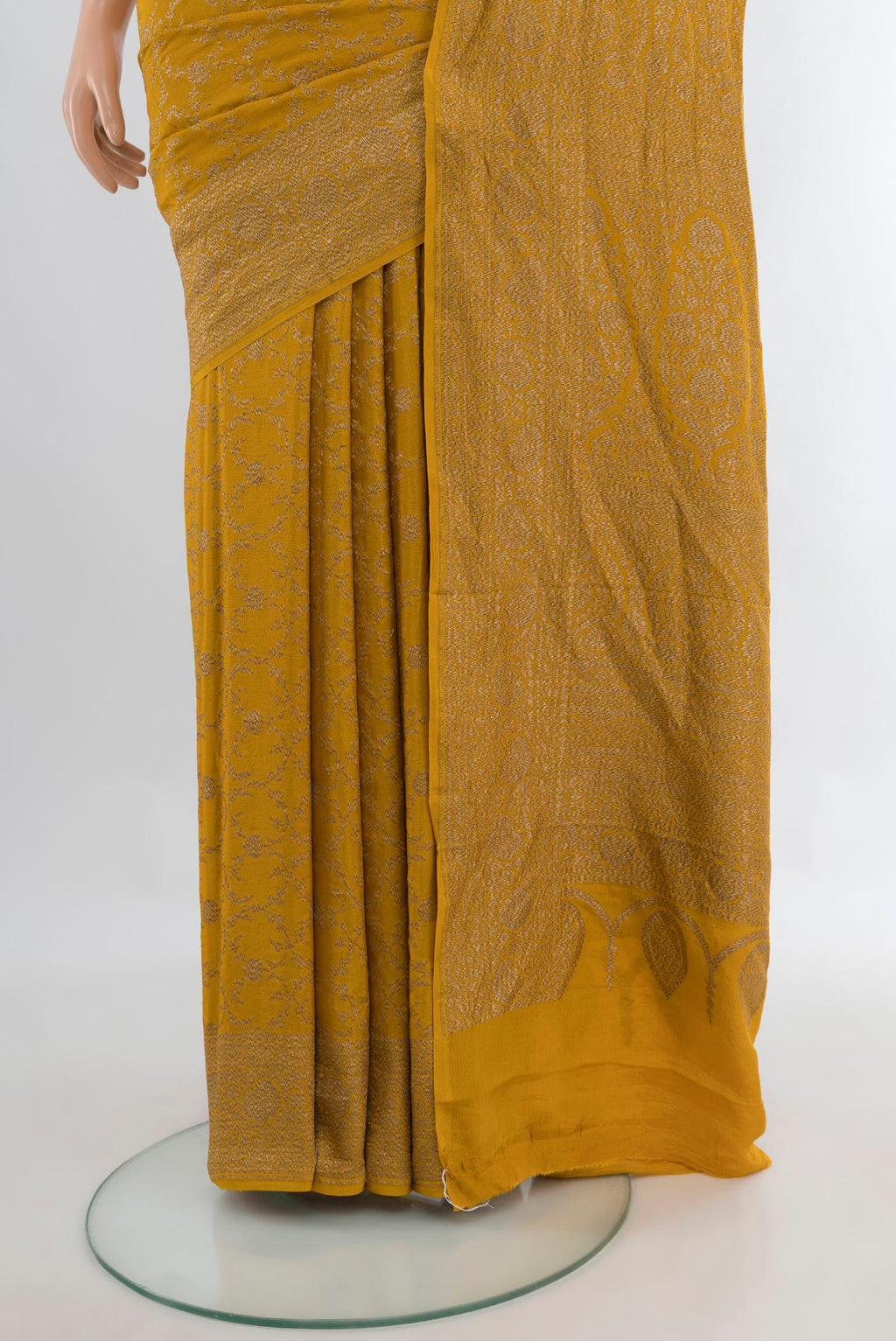 Pleats and pallu of Mustard Banarasi Georgette Saree with Zari Brocade on the body and Zari Border. 
