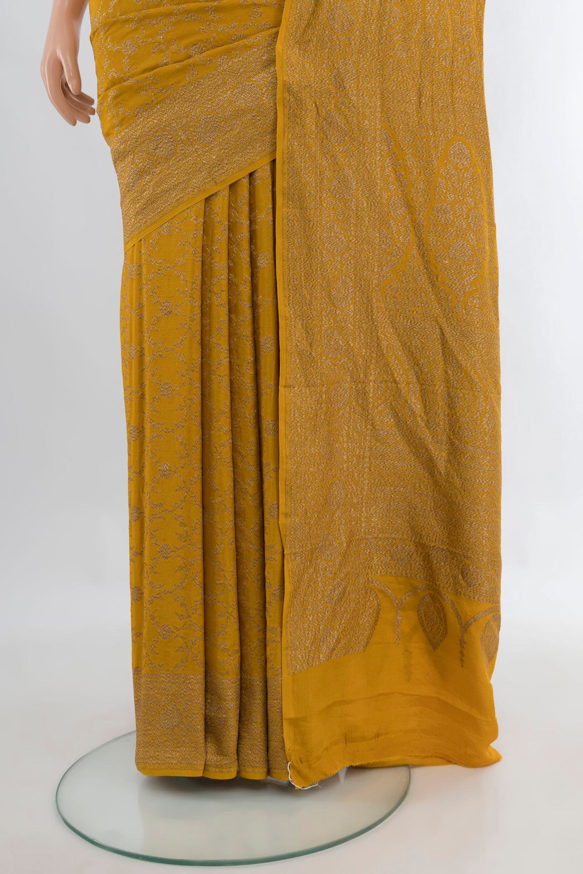 Pleats and pallu of Mustard Banarasi Georgette Saree with Zari Brocade on the body and Zari Border. 