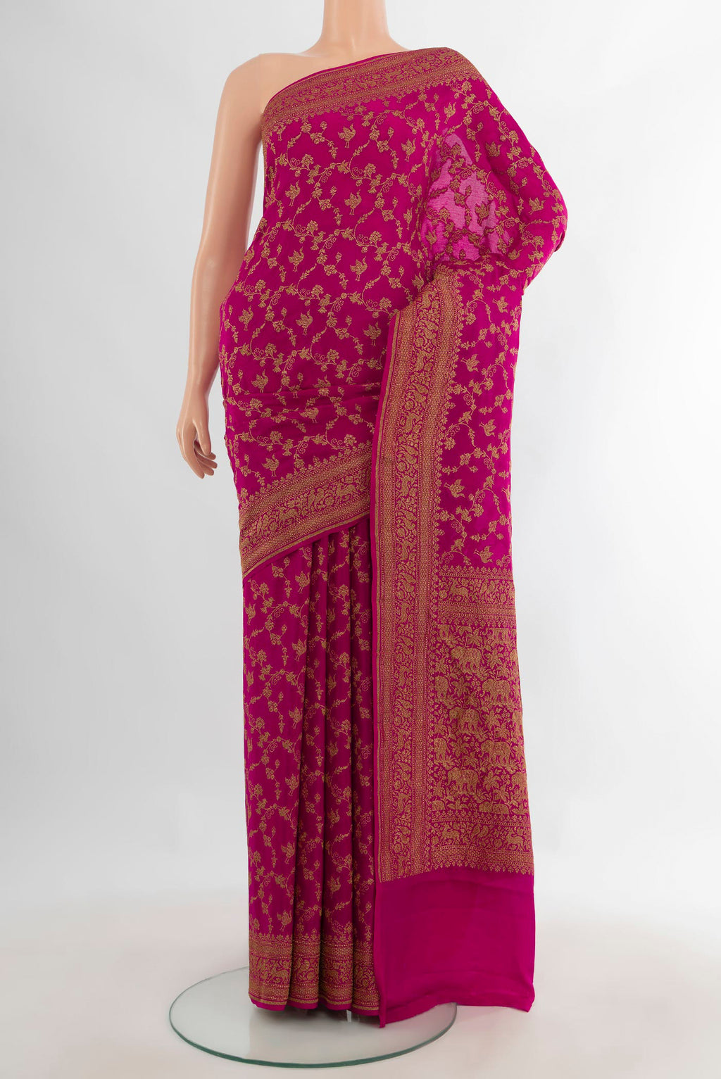 Pink Banarasi Georgette Saree with Zari Brocade on the body and Zari Border.  displayed on a mannequin