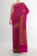 Pink Banarasi Georgette Saree with Zari Brocade on the body and Zari Border.  displayed on a mannequin