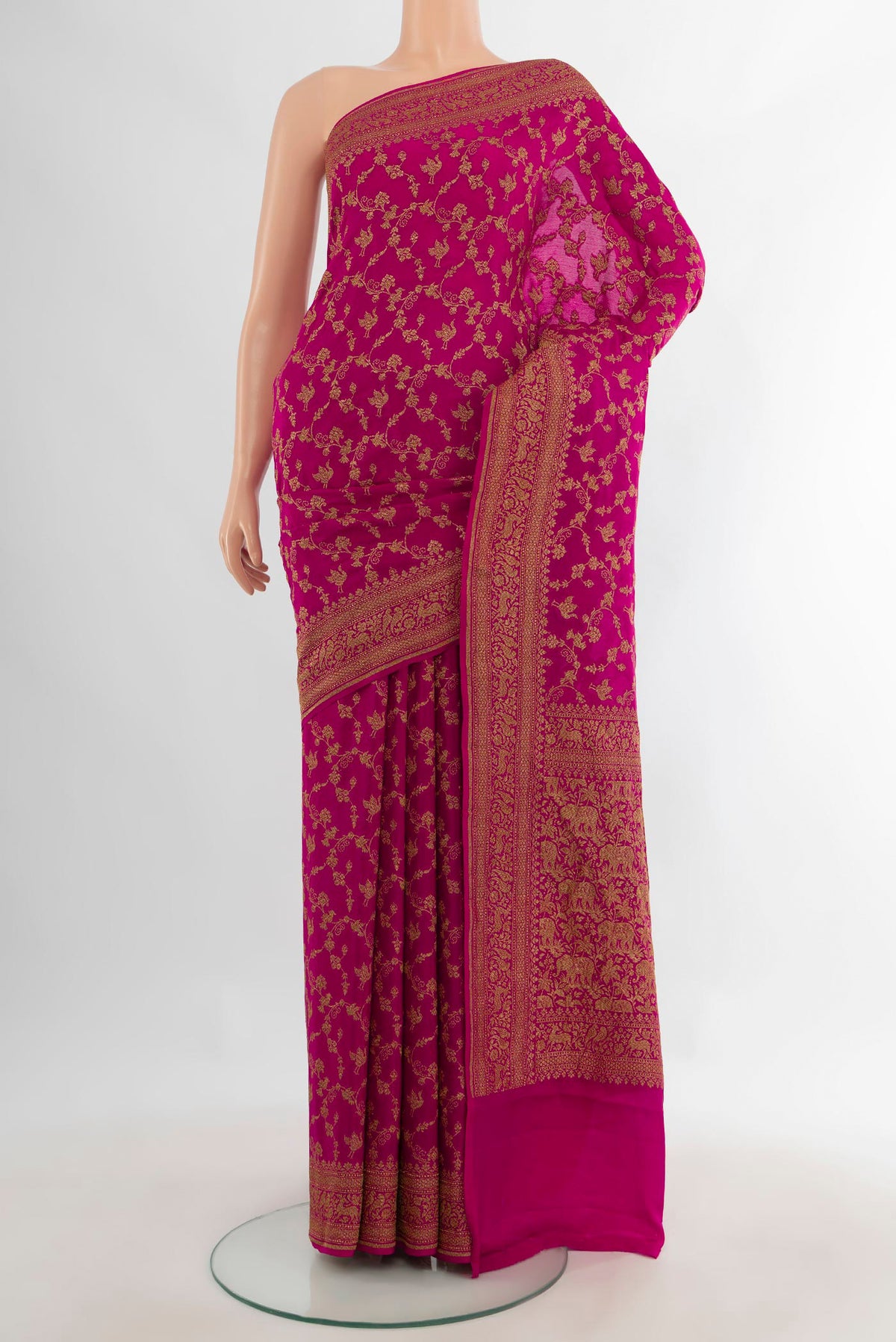 Pink Banarasi Georgette Saree with Zari Brocade on the body and Zari Border.  displayed on a mannequin