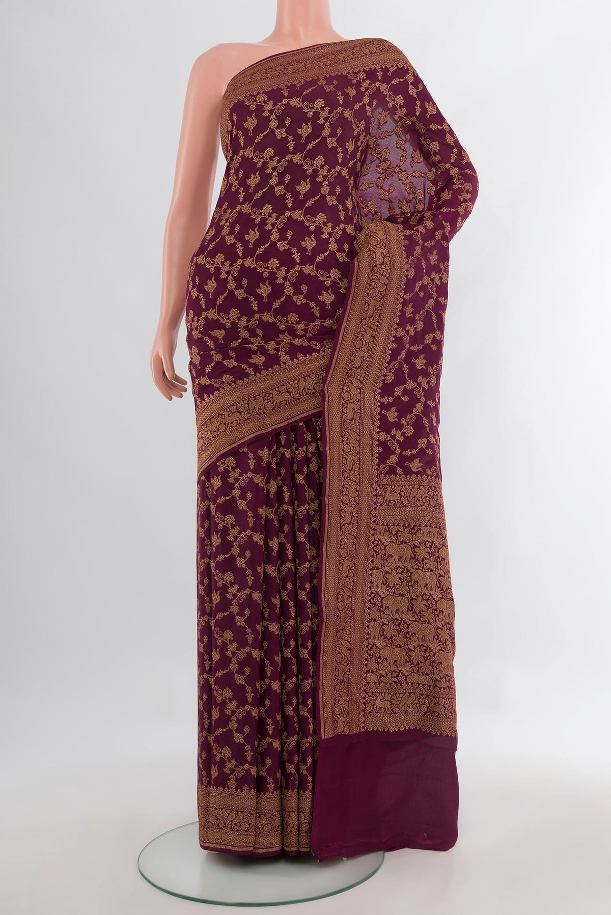 Coffee Brown Banarasi Georgette Saree with Zari Brocade on the body and Zari Border.  displayed on a mannequin