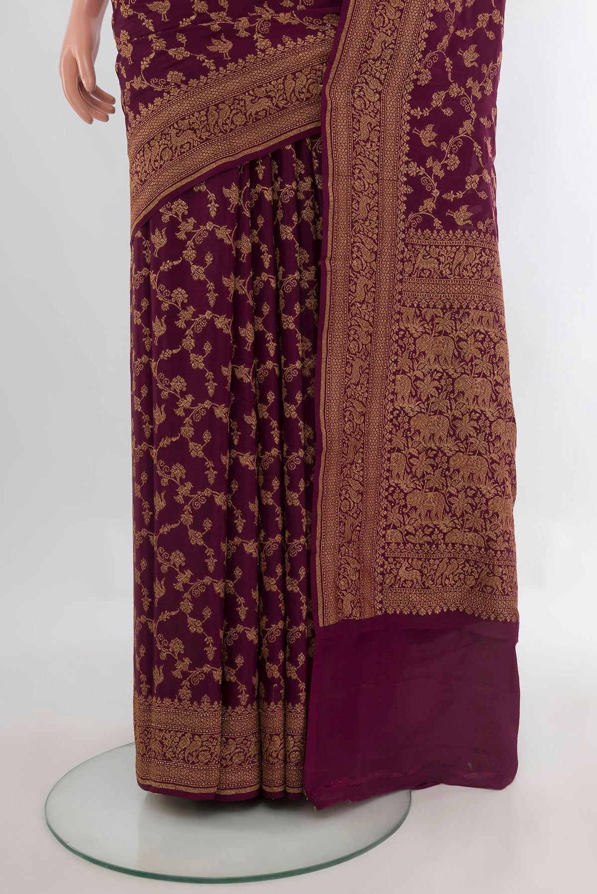 Pleats and pallu of Coffee Brown Banarasi Georgette Saree with Zari Brocade on the body and Zari Border. 