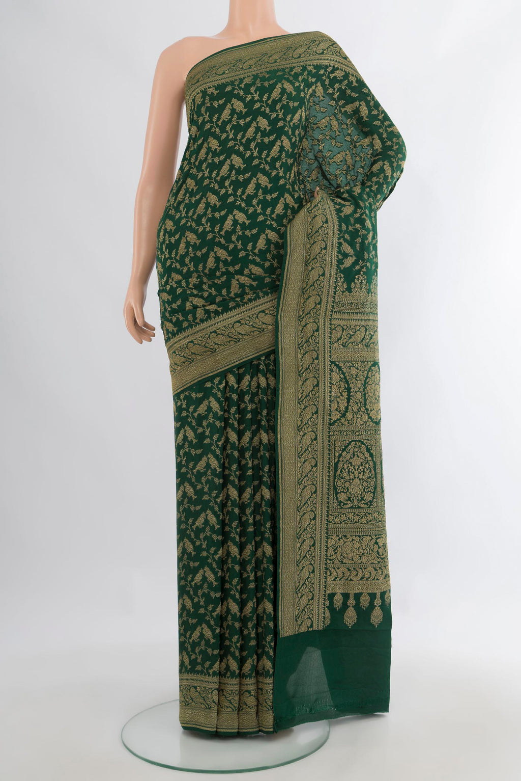 Bottle Green Banarasi Georgette Saree with Zari Brocade on the body and Zari Border.  displayed on a mannequin