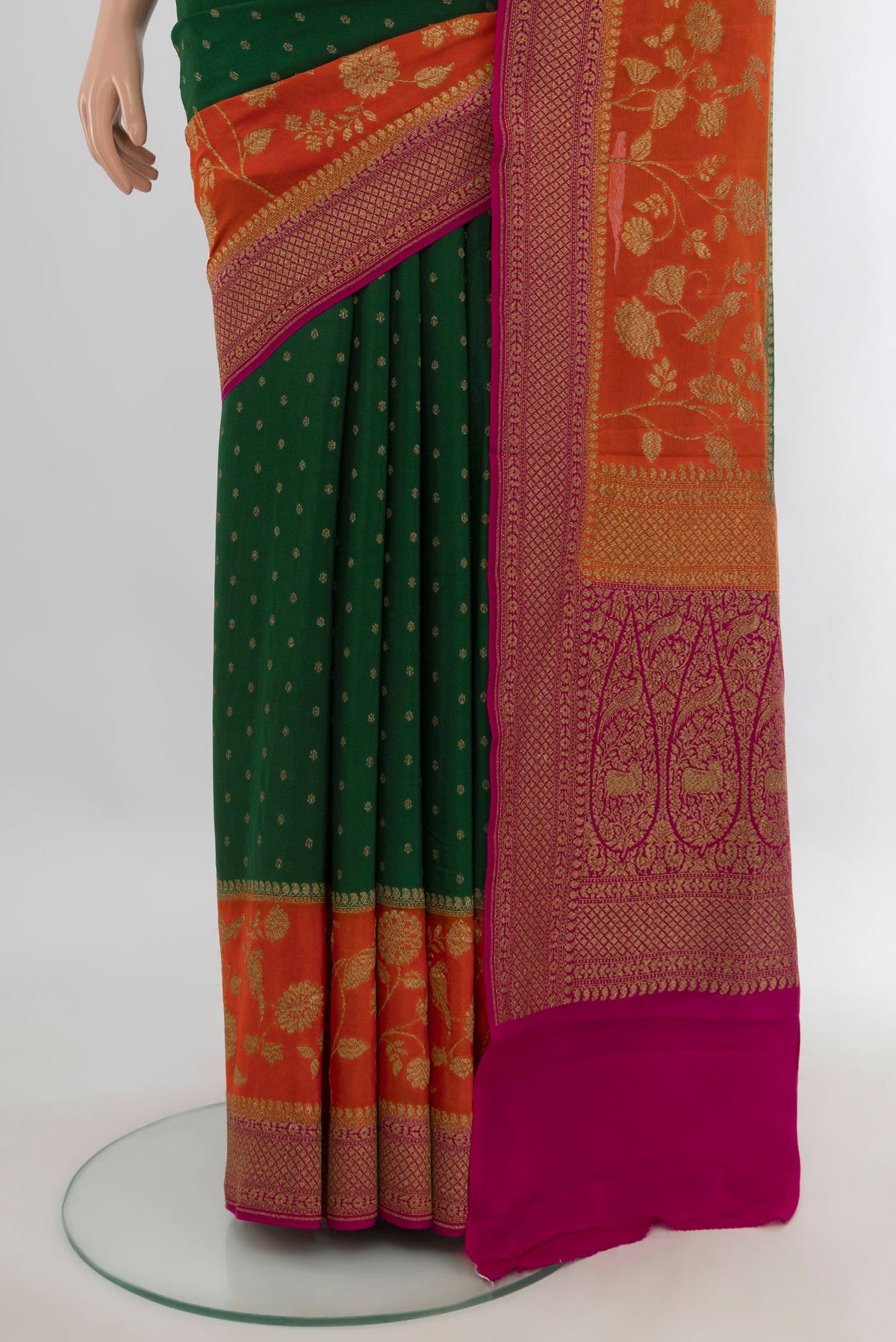 Pleats and pallu of Bottle Green Banarasi Georgette Saree with Zari Butta on the body and Zari Border. 
