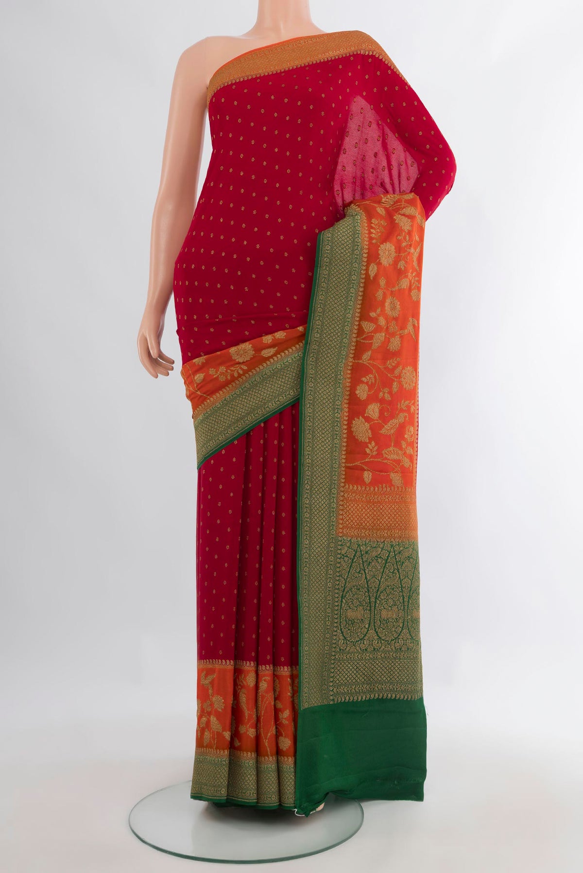 Red Banarasi Georgette Saree with Zari Butta on the body and Zari Border.  displayed on a mannequin