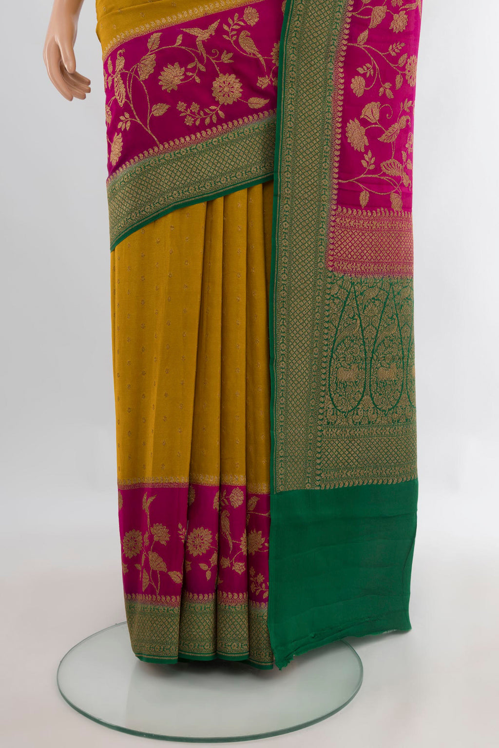 Pleats and pallu of Mustard Banarasi Georgette Saree with Zari Butta on the body and Zari Border. 