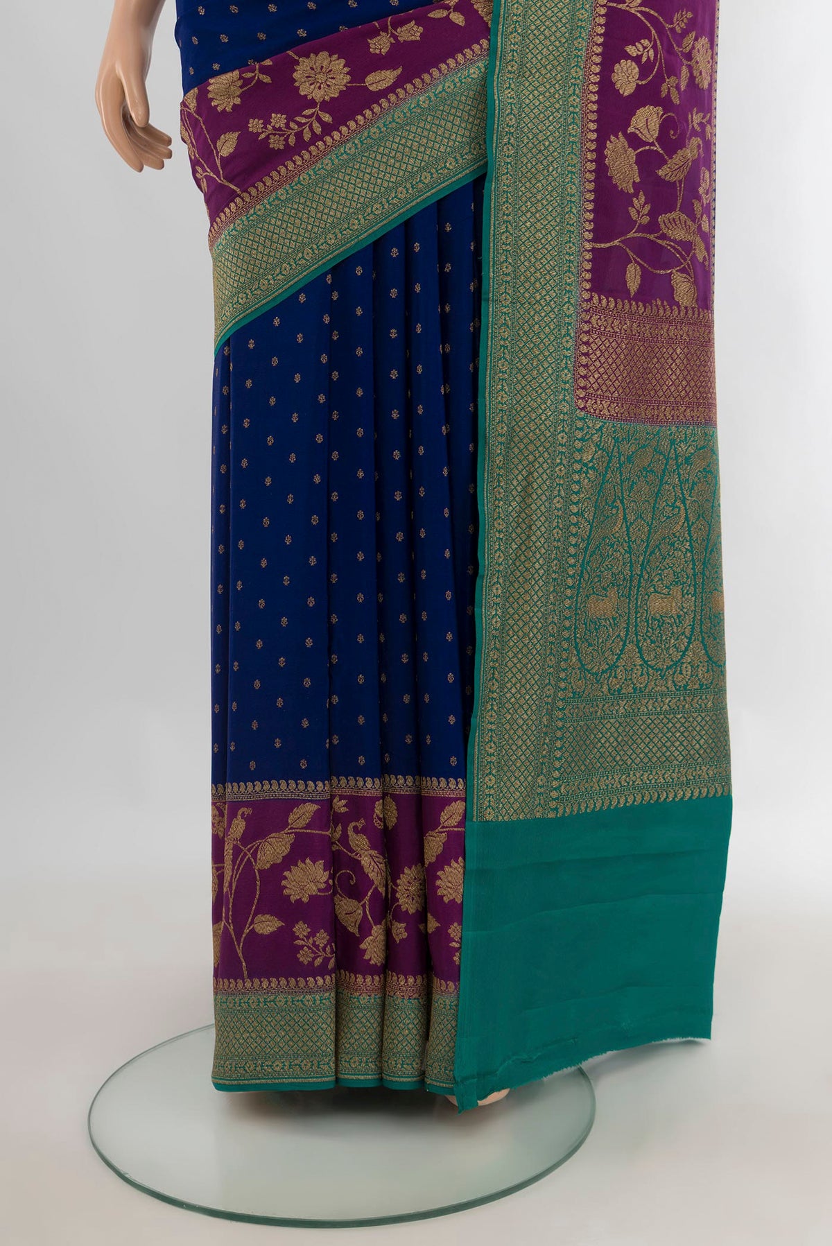 Pleats and pallu of Blue Banarasi Georgette Saree with Zari Butta on the body and Zari Border. 