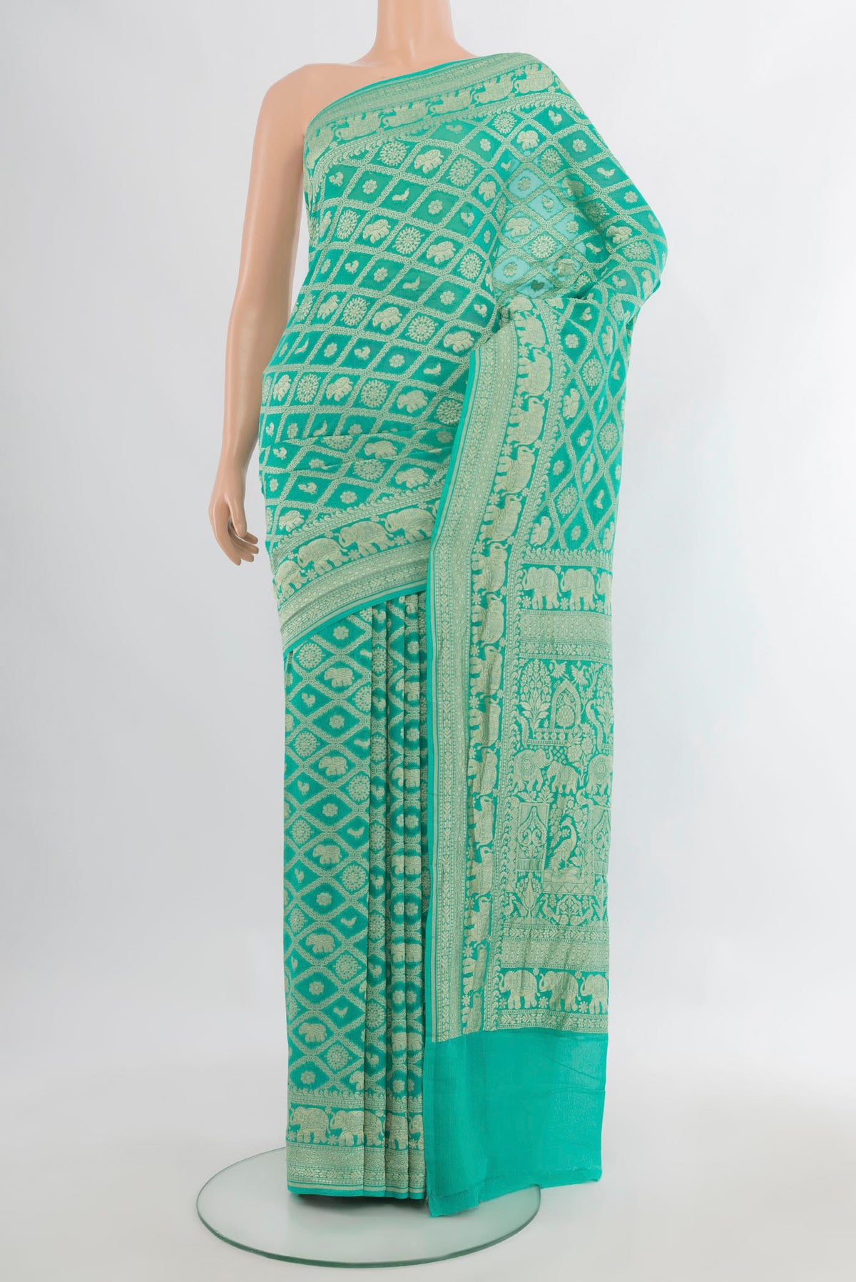 Sea Green Banarasi Georgette Saree with Zari Brocade on the body and Zari Border.  displayed on a mannequin