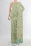 Light Green Banarasi Georgette Saree with Zari Brocade on the body and Zari Border.  displayed on a mannequin