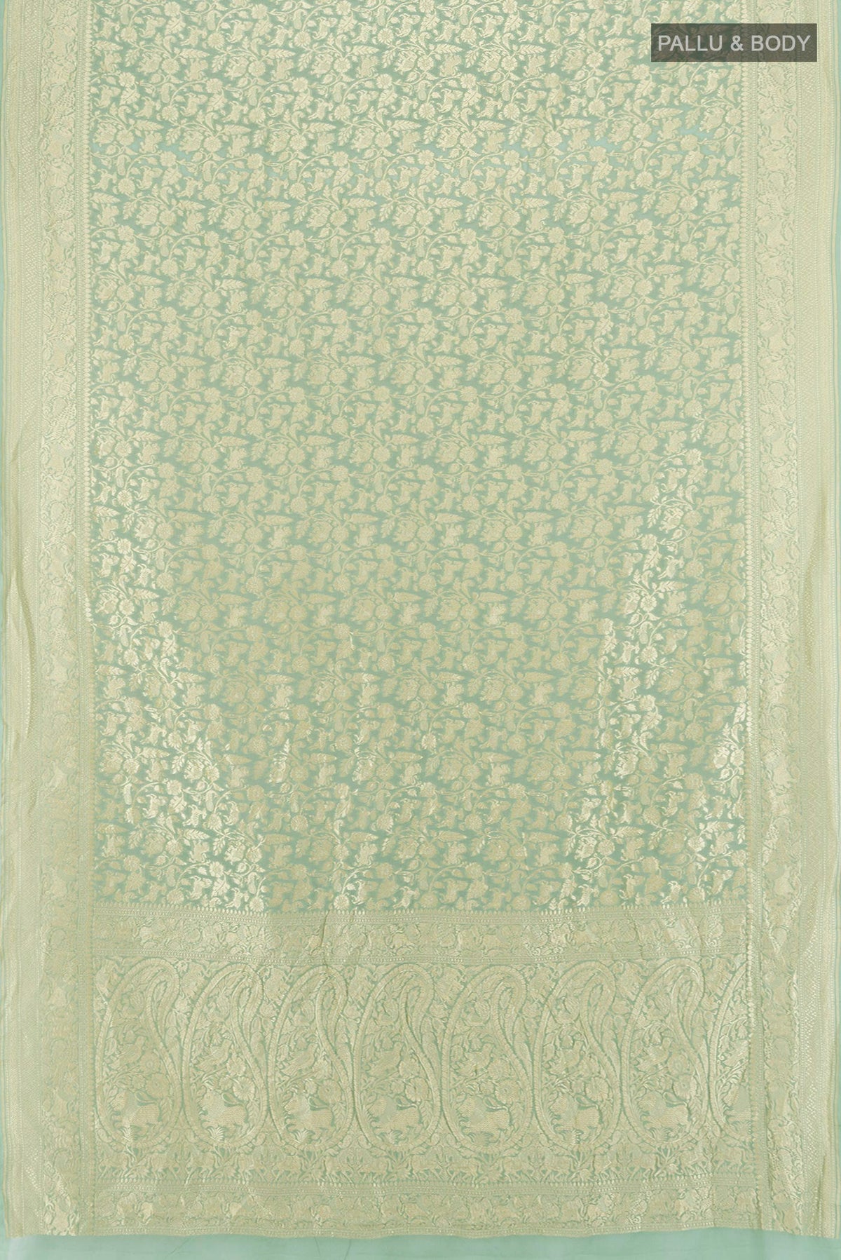 Flat view of Light Green Banarasi Georgette Saree with Zari Brocade on the body and Zari Border. 