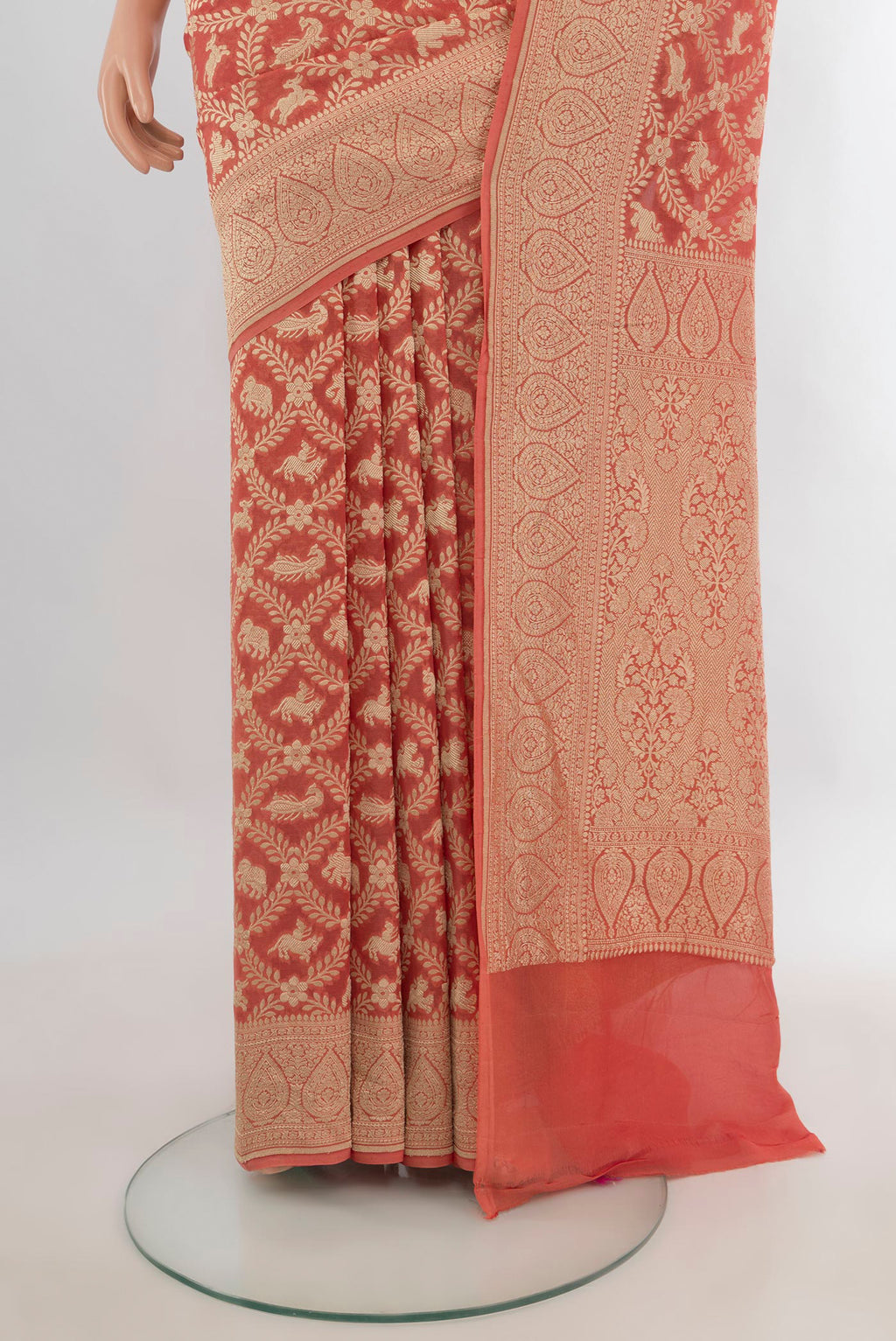 Pleats and pallu of Peach Banarasi Georgette Saree with Zari Butta on the body and Zari Border. 