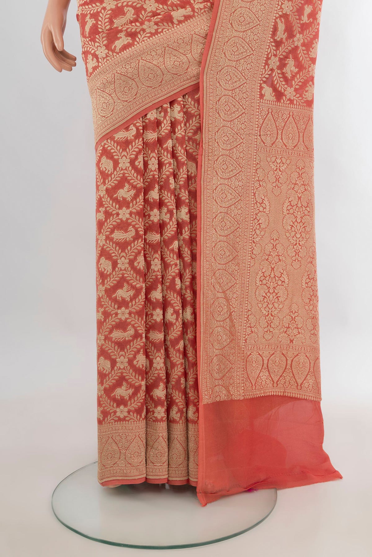 Pleats and pallu of Peach Banarasi Georgette Saree with Zari Butta on the body and Zari Border. 