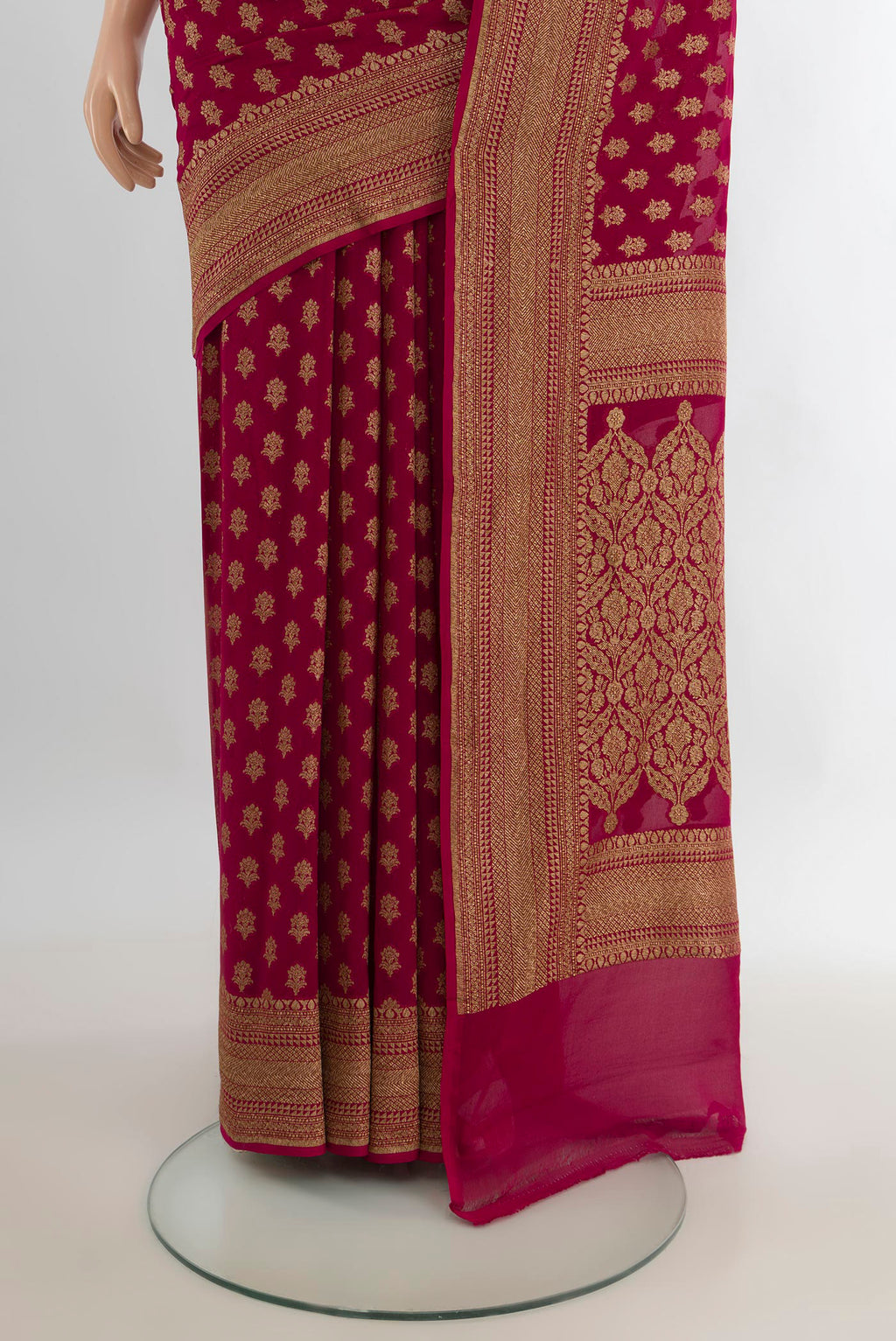 Pleats and pallu of Maroon Banarasi Georgette Saree with Zari Butta on the body and Zari Border. 