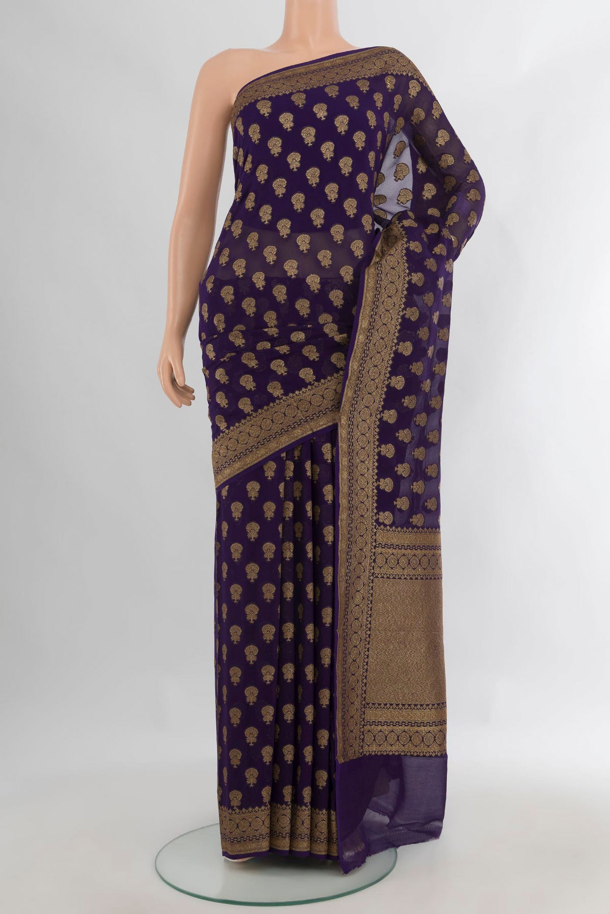 Navy Blue Banarasi Georgette Saree with Zari Butta on the body and Zari And Thread Border.  displayed on a mannequin
