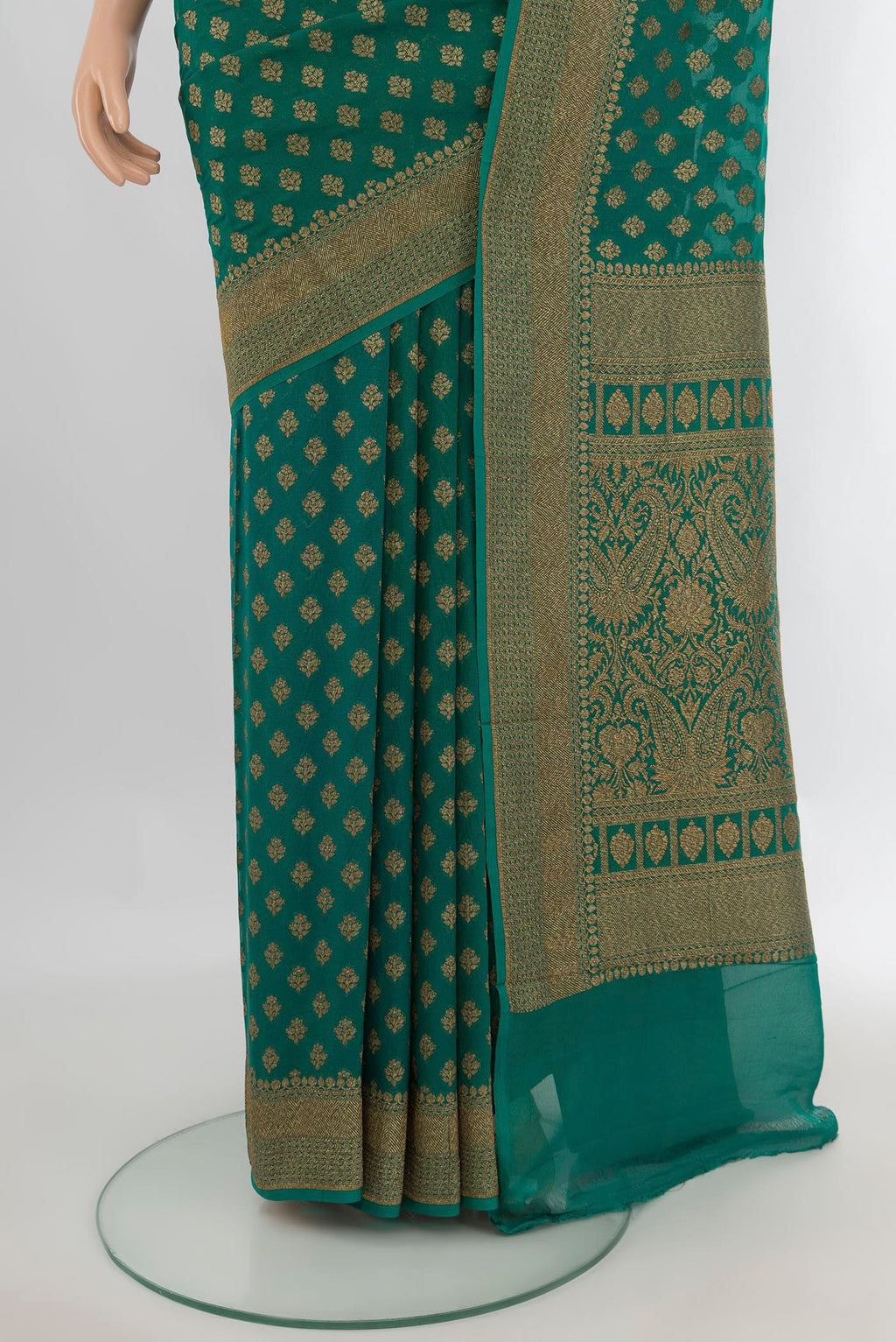 Pleats and pallu of Green Banarasi Georgette Saree with Zari Butta on the body and Zari Border. 