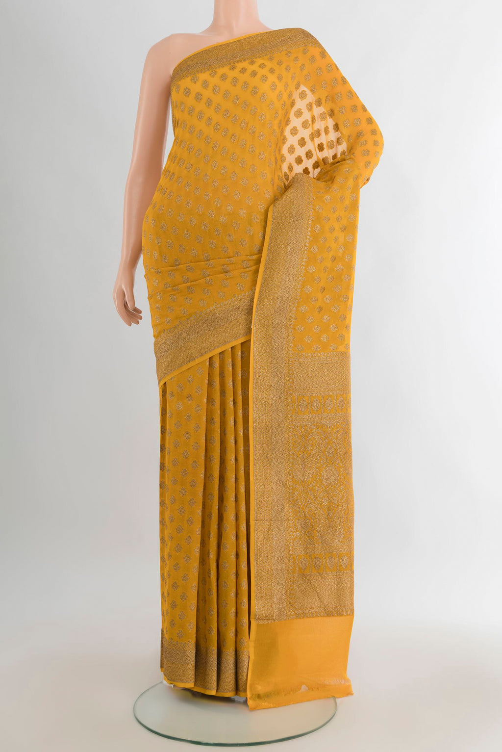 Yellow Banarasi Georgette Saree with Zari Brocade on the body and Zari Border.  displayed on a mannequin