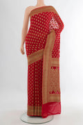 Red Banarasi Georgette Saree with Zari Butta on the body and Zari Border.  displayed on a mannequin