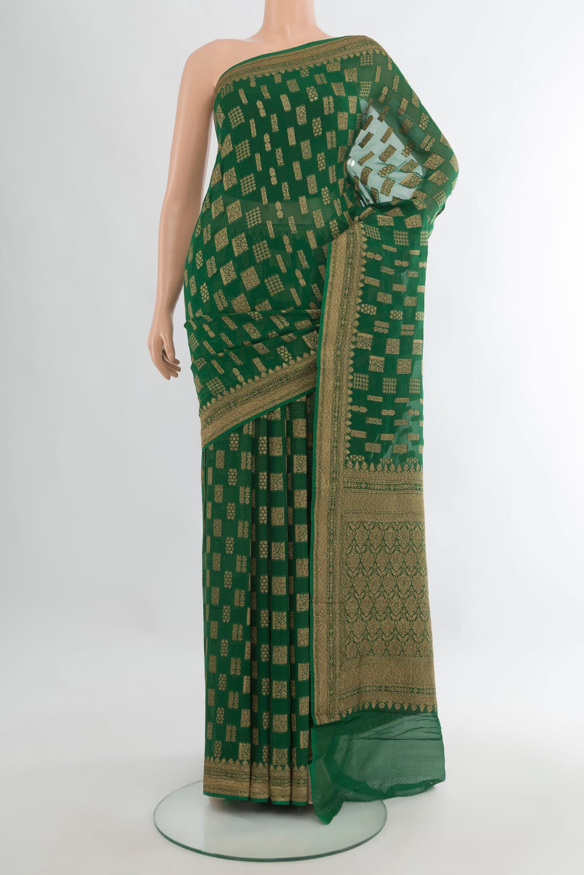 Bottle Green Banarasi Georgette Saree with Zari Butta on the body and Zari Border.  displayed on a mannequin