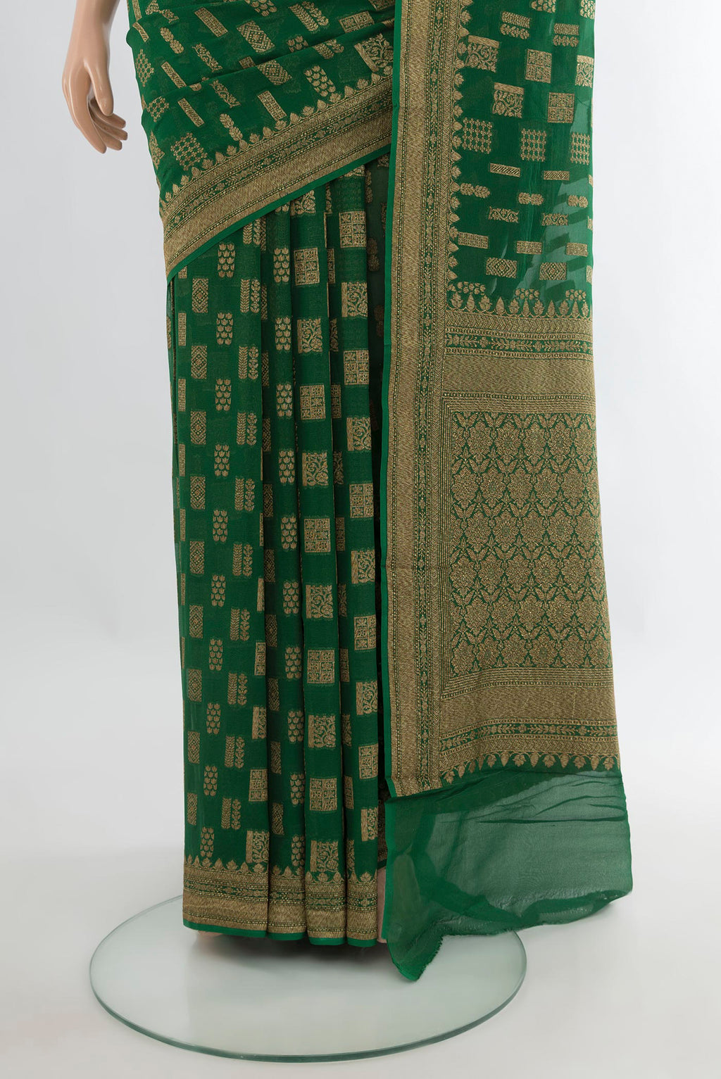 Pleats and pallu of Bottle Green Banarasi Georgette Saree with Zari Butta on the body and Zari Border. 