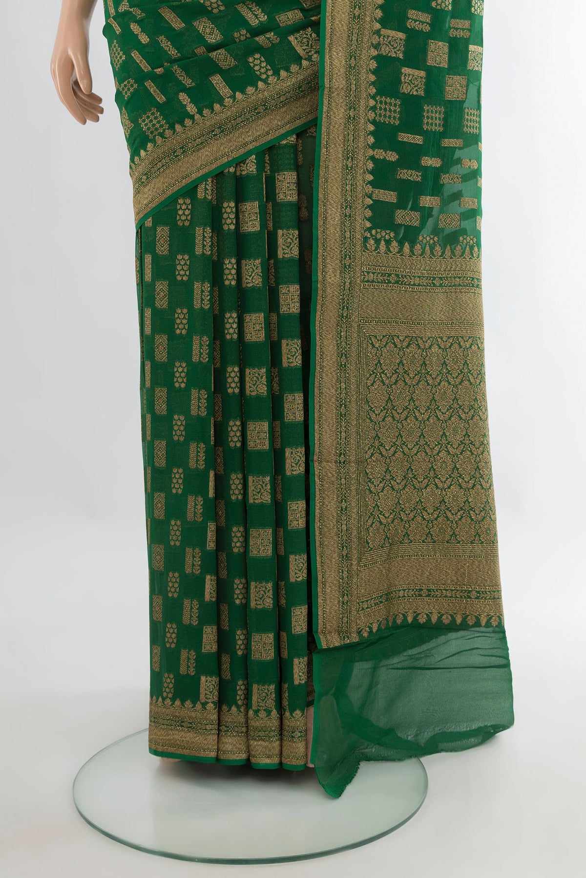 Pleats and pallu of Bottle Green Banarasi Georgette Saree with Zari Butta on the body and Zari Border. 
