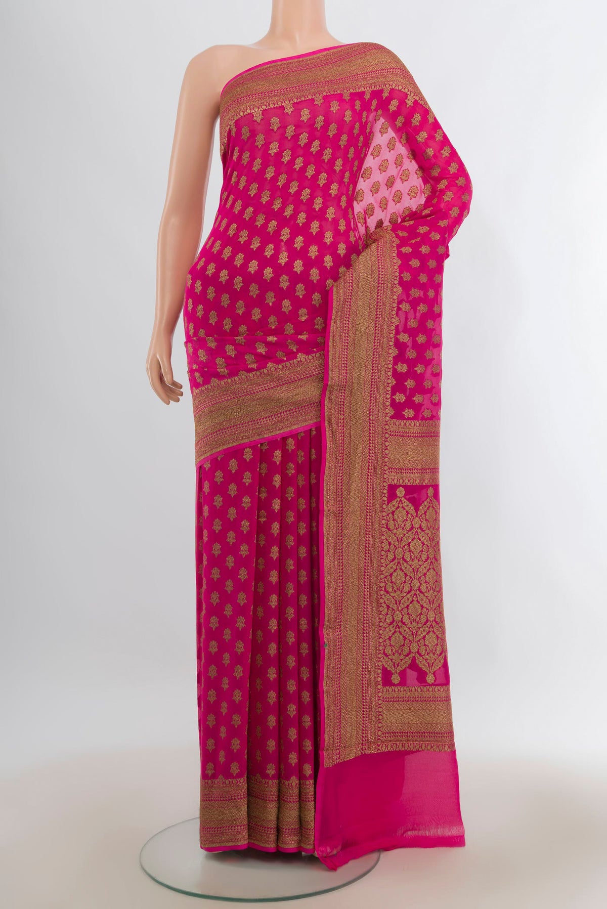 Rani Pink Banarasi Georgette Saree with Zari Butta on the body and Zari Border.  displayed on a mannequin