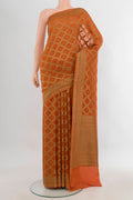 Brick Orange Banarasi Georgette Saree with Zari Brocade on the body and Zari Border.  displayed on a mannequin