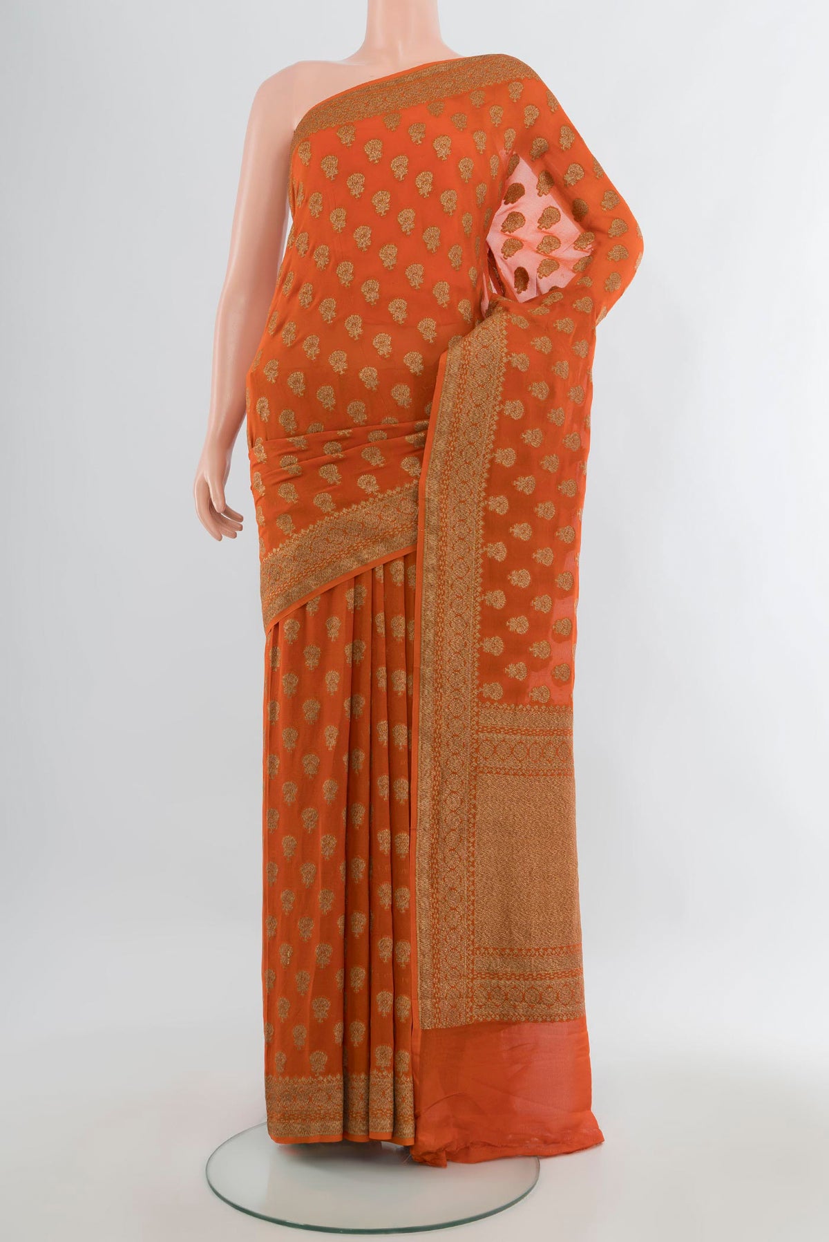 Orange Banarasi Georgette Saree with Zari Butta on the body and Zari Border.  displayed on a mannequin