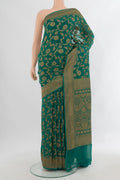 Sea Green Banarasi Georgette Saree with Zari Butta on the body and Zari Border.  displayed on a mannequin
