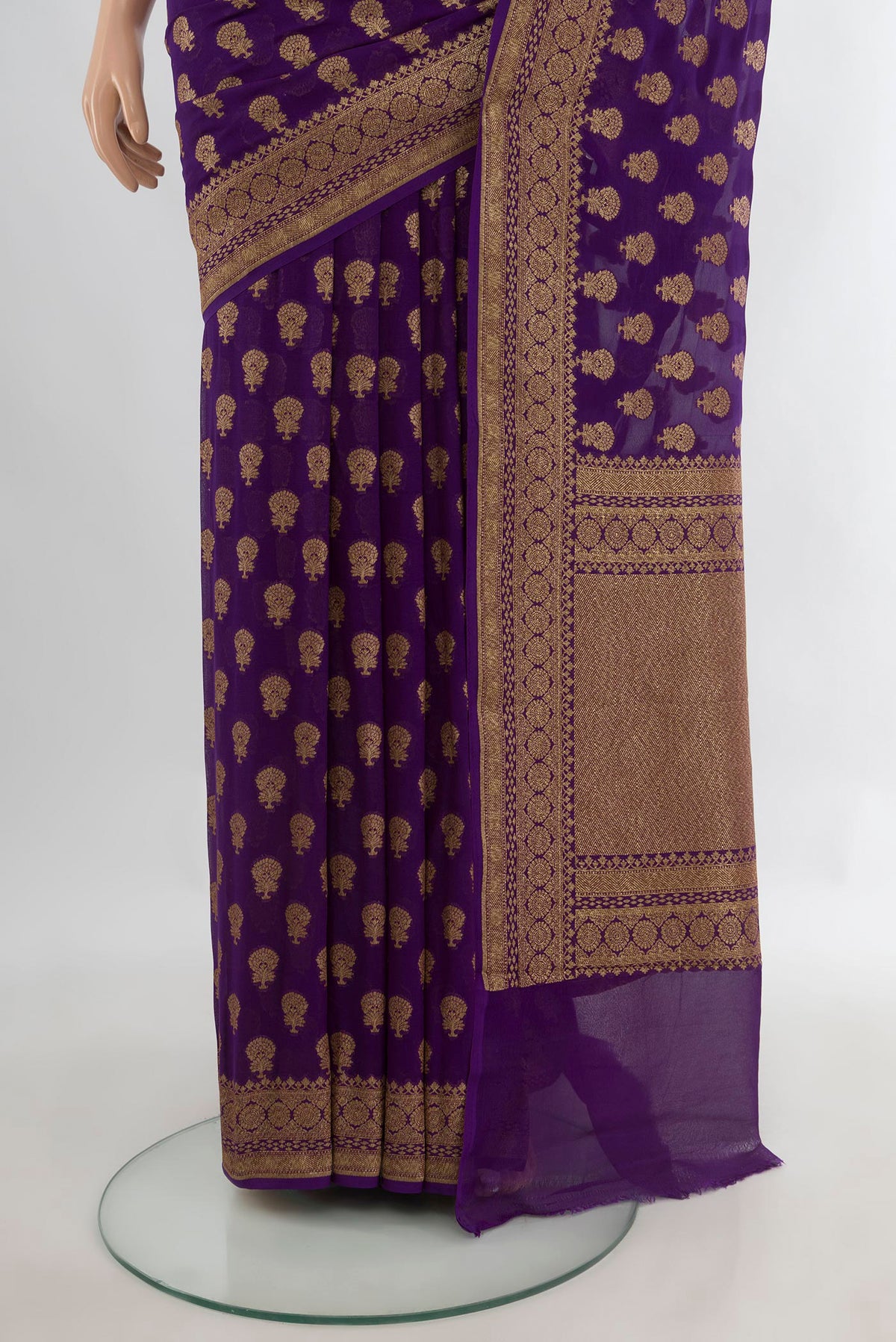 Pleats and pallu of Violet Banarasi Georgette Saree with Zari Butta on the body and Zari Border. 