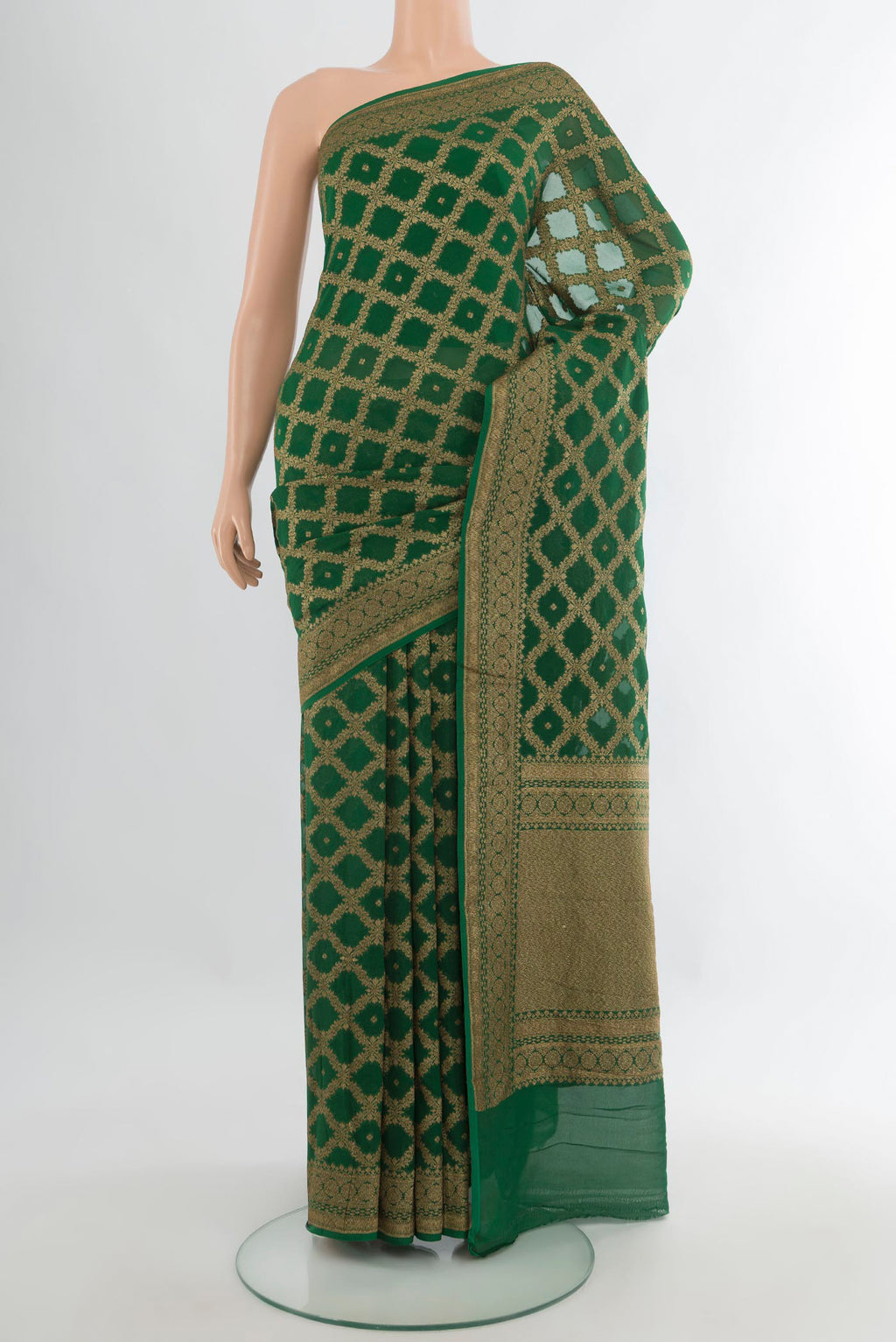 Bottle Green Banarasi Georgette Saree with Zari Butta on the body and Zari Border.  displayed on a mannequin