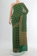 Bottle Green Banarasi Georgette Saree with Zari Butta on the body and Zari Border.  displayed on a mannequin