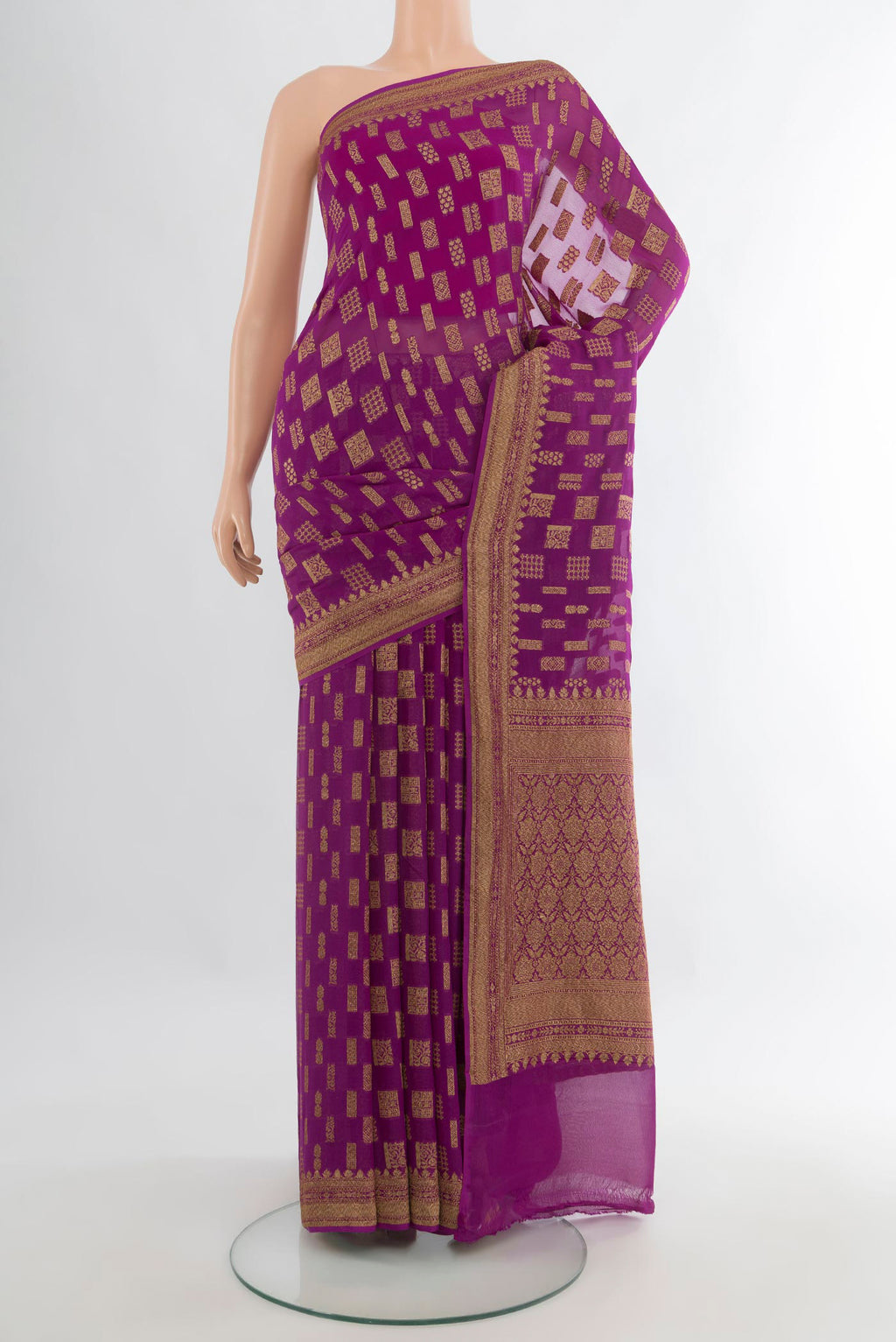 Magenta Banarasi Georgette Saree with Zari Butta on the body and Zari Border.  displayed on a mannequin