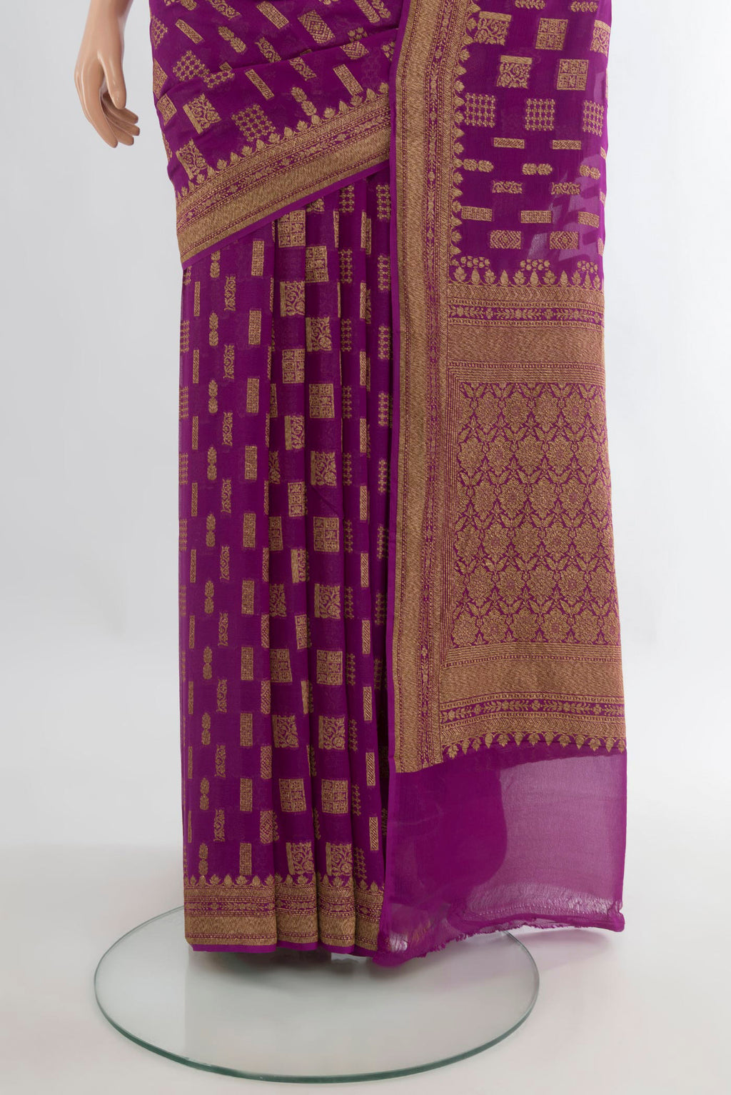 Pleats and pallu of Magenta Banarasi Georgette Saree with Zari Butta on the body and Zari Border. 