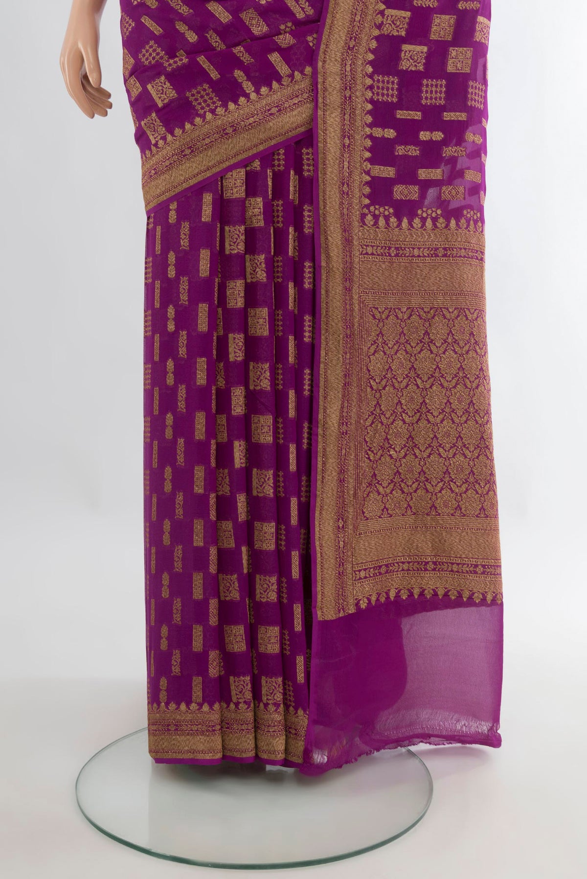 Pleats and pallu of Magenta Banarasi Georgette Saree with Zari Butta on the body and Zari Border. 